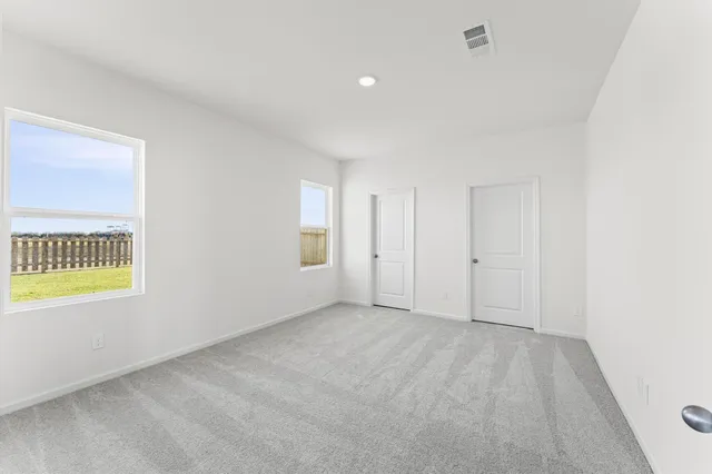 an empty room with windows