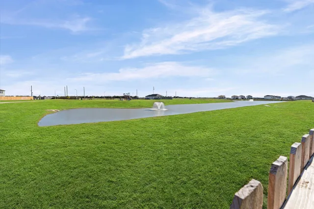 a view of field and ocean