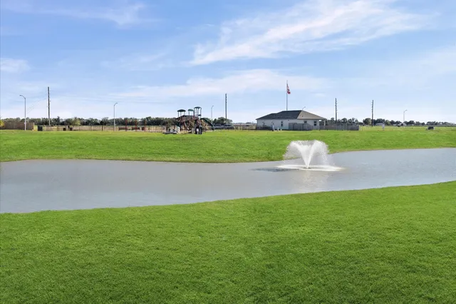 a view of a golf course with a lake