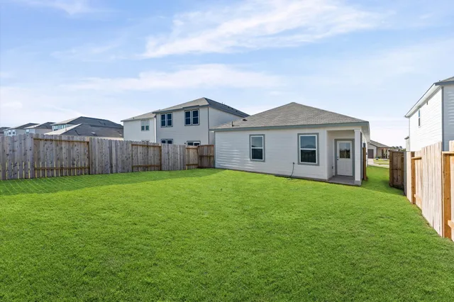 a view of a house with a back yard