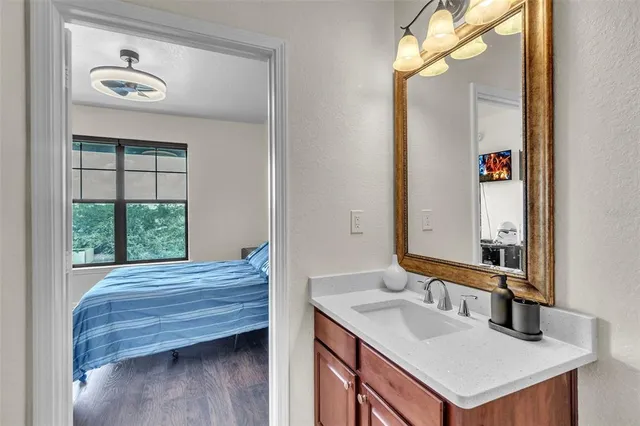 a bathroom with a sink and a mirror