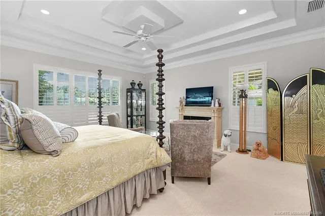 a bedroom with double bed and a large mirror