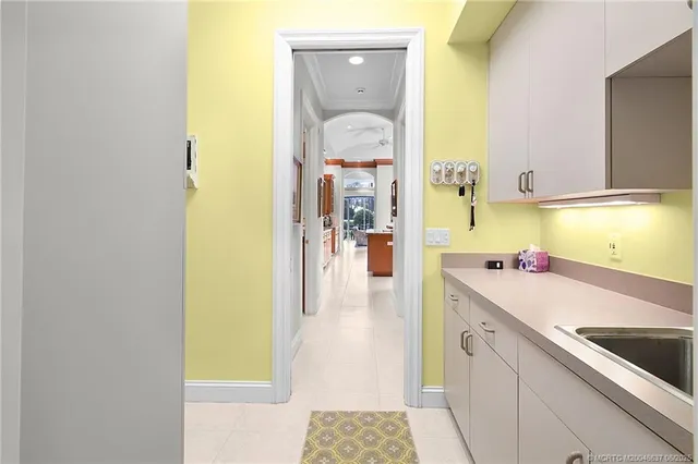 a kitchen with a sink and a refrigerator