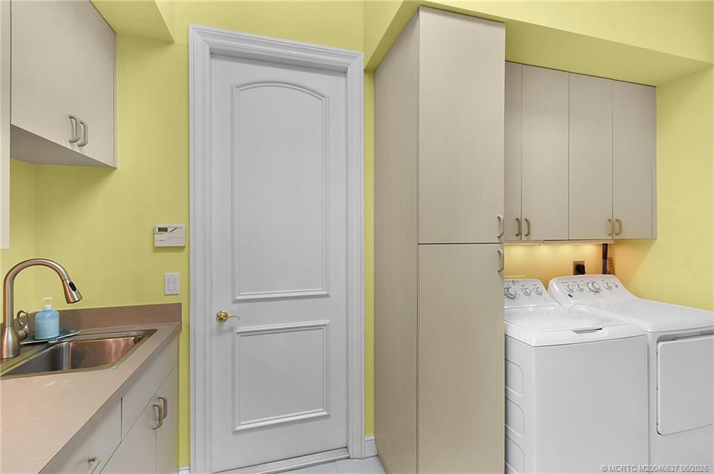 1572 Southeast Cypress Glen Way Stuart, FL 34997 - Photo 26 of 49 a bathroom with a sink a toilet and shower