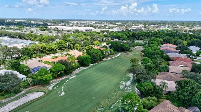 an aerial view of residential houses with outdoor space and garden
