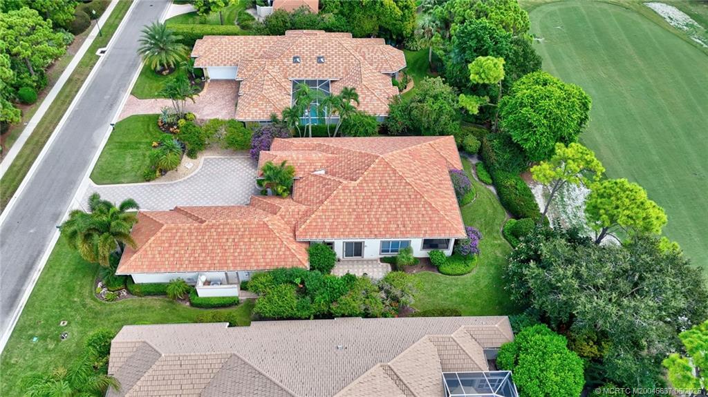 1572 Southeast Cypress Glen Way Stuart, FL 34997 - Photo 38 of 49 an aerial view of a house