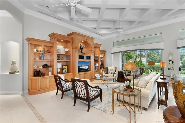 a dining room with furniture water view and a large window