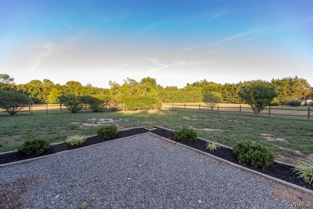 19821 River Road Sutherland, VA 23885 - Photo 32 of 43 rear fenced area and flower beds