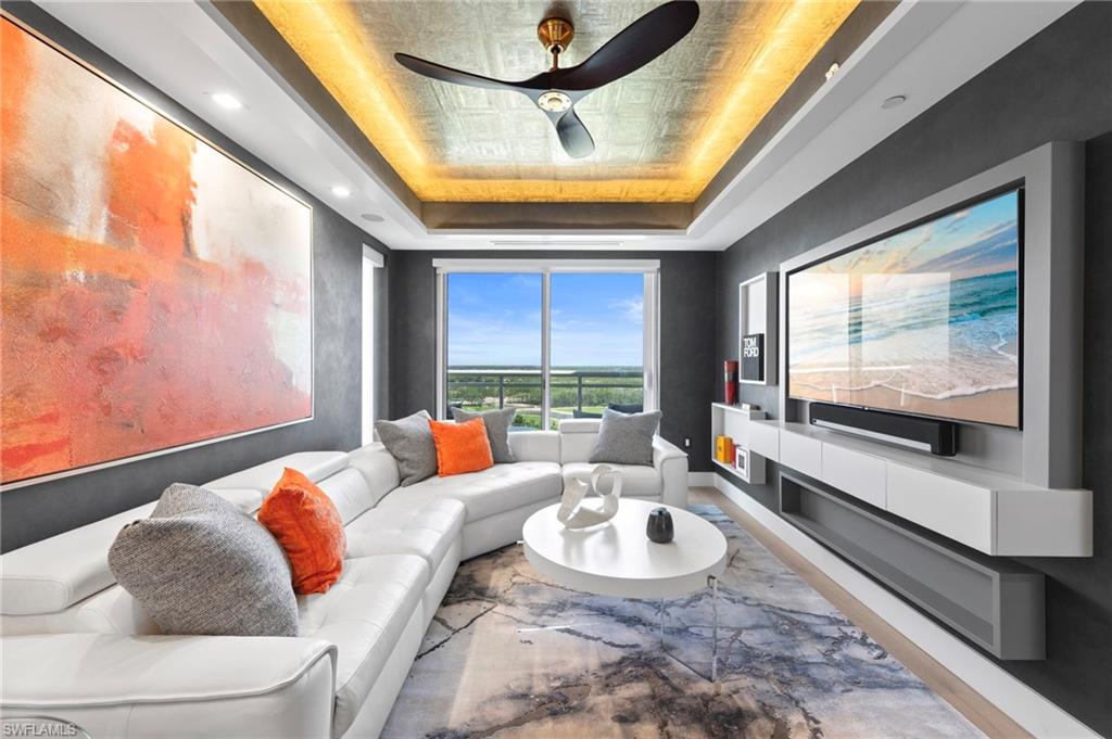 13915 Old Coast Road, Unit 1706 Naples, FL 34110 - Photo 20 of 49 a living room with furniture and a large window