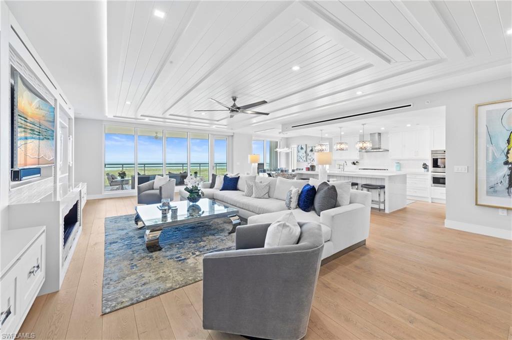 13915 Old Coast Road, Unit 1706 Naples, FL 34110 - Photo 2 of 49 a living room with furniture kitchen view and a large window