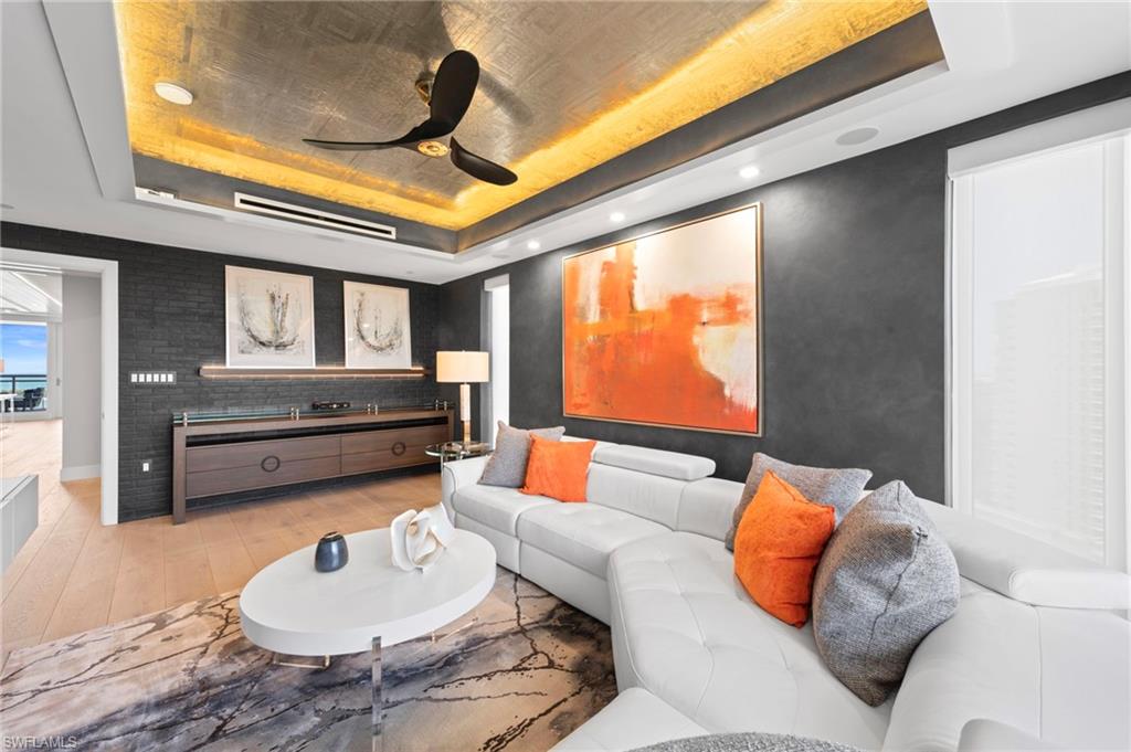 13915 Old Coast Road, Unit 1706 Naples, FL 34110 - Photo 21 of 49 a living room with furniture and a large window