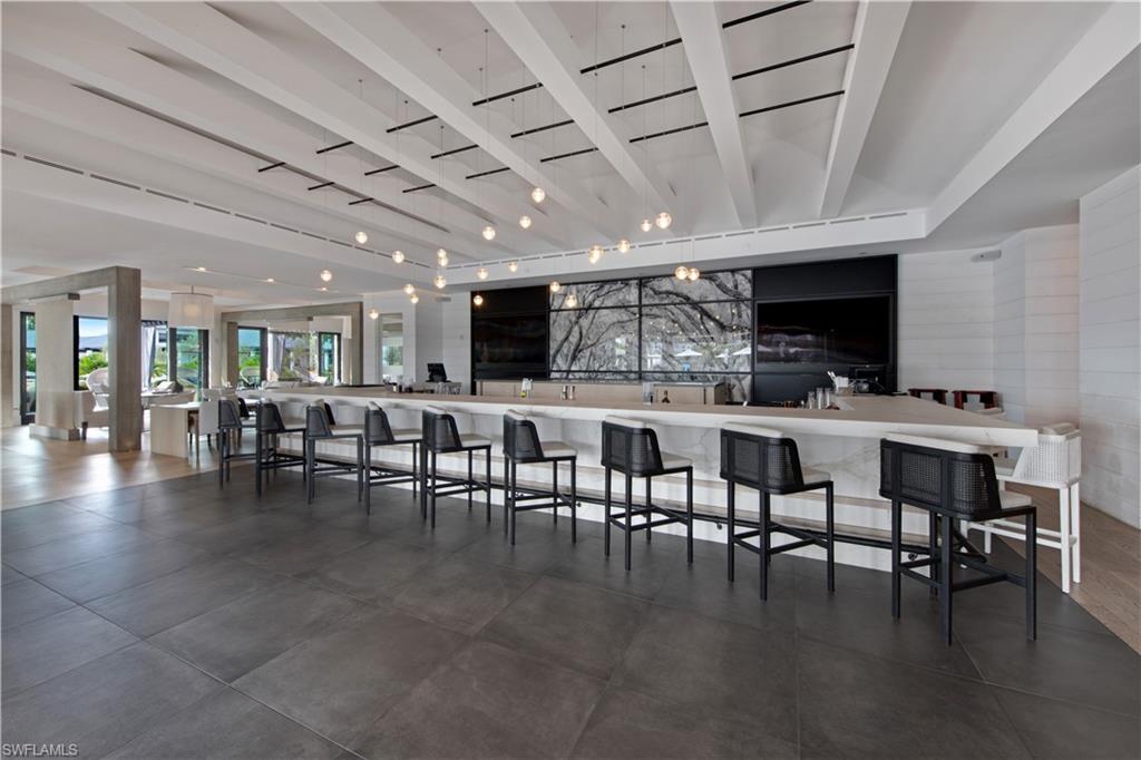 13915 Old Coast Road, Unit 1706 Naples, FL 34110 - Photo 42 of 49 a group of dining room with furniture and kitchen view