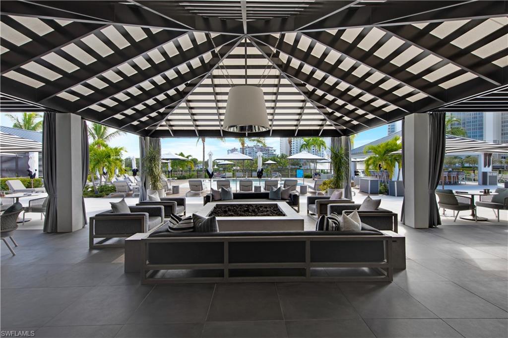 13915 Old Coast Road, Unit 1706 Naples, FL 34110 - Photo 43 of 49 a outdoor space with patio lots of furniture