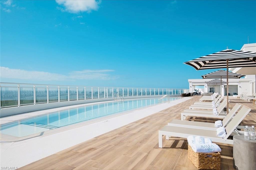13915 Old Coast Road, Unit 1706 Naples, FL 34110 - Photo 48 of 49 a view of balcony with wooden floor and seating space