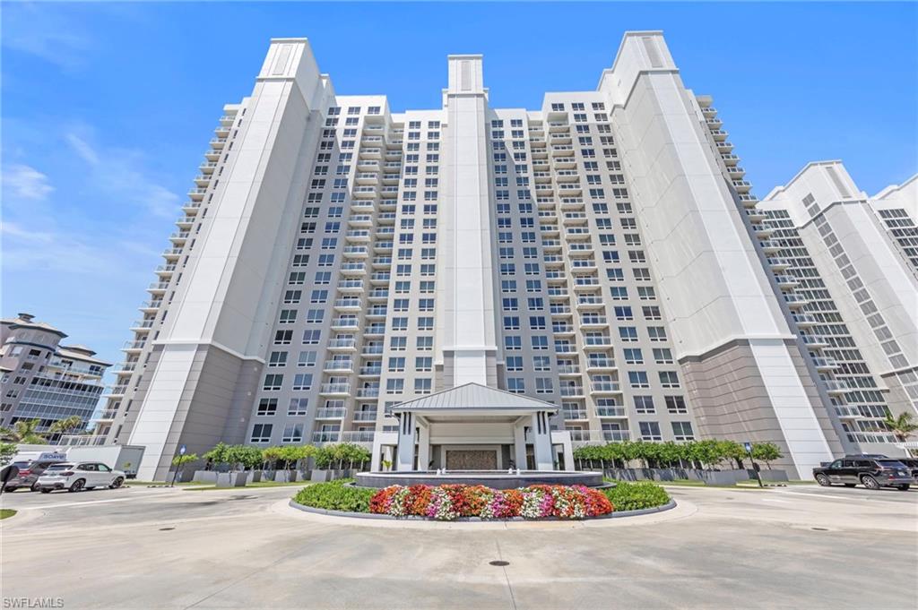 13915 Old Coast Road, Unit 1706 Naples, FL 34110 - Photo 49 of 49 a front view of a building with streets and trees