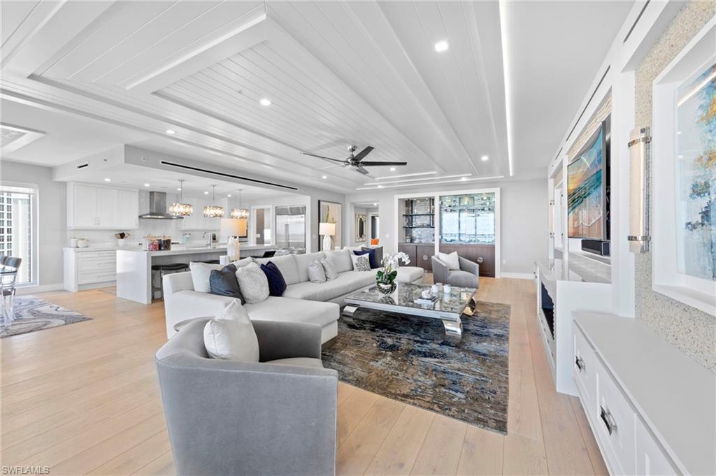 13915 Old Coast Road, Unit 1706 Naples, FL 34110 - Photo 6 of 49 a living room with furniture and a large window