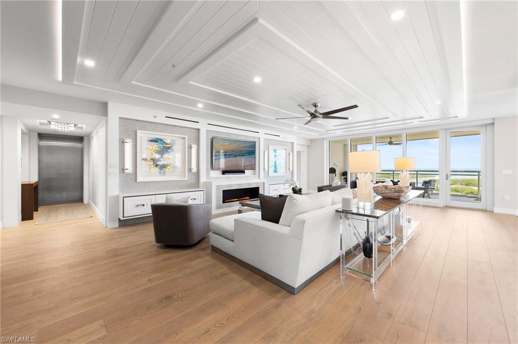 13915 Old Coast Road, Unit 1706 Naples, FL 34110 - Photo 8 of 49 a living room with furniture and a large window