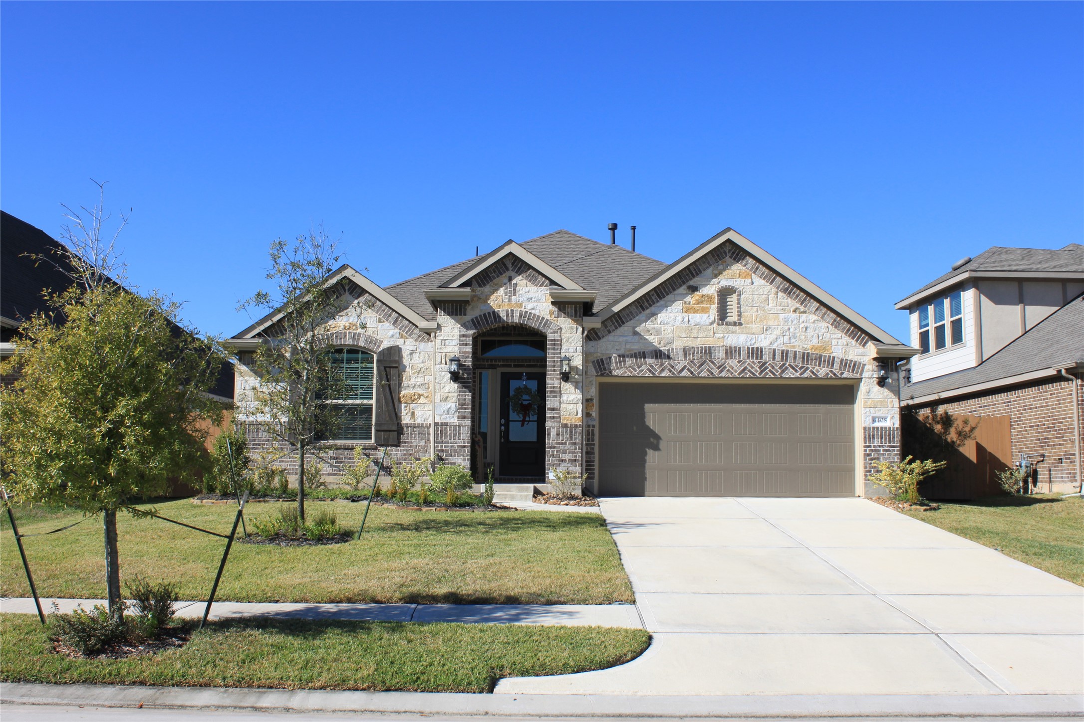 4408 Mimic Drive Spring, TX 77386 - Photo 1 of 27 a front view of a house with garden