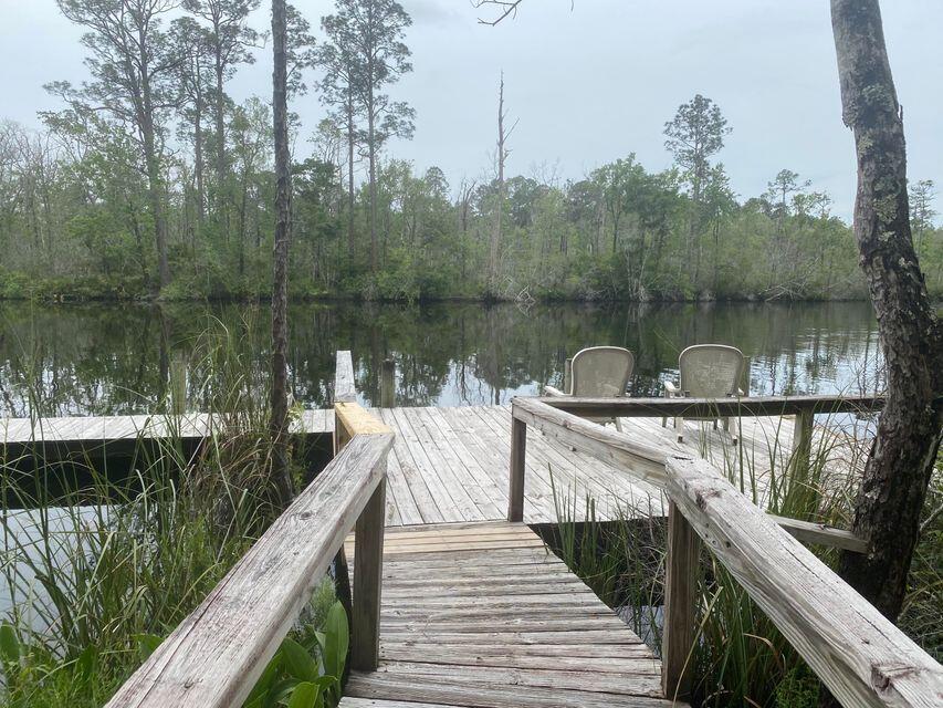 Lot 27 Fishermans Run Freeport, FL 32439 - Photo 3 of 11 a lake view with a wooden bridge