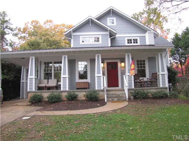 2205 The Circle Raleigh, NC 27608 - Photo 1 of 5 a front view of a house with a yard and porch