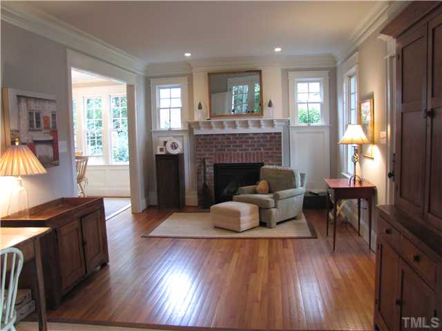 2205 The Circle Raleigh, NC 27608 - Photo 3 of 5 a living room with furniture and a fireplace