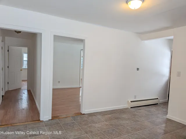 a view of a kitchen with a sink and a stove top oven