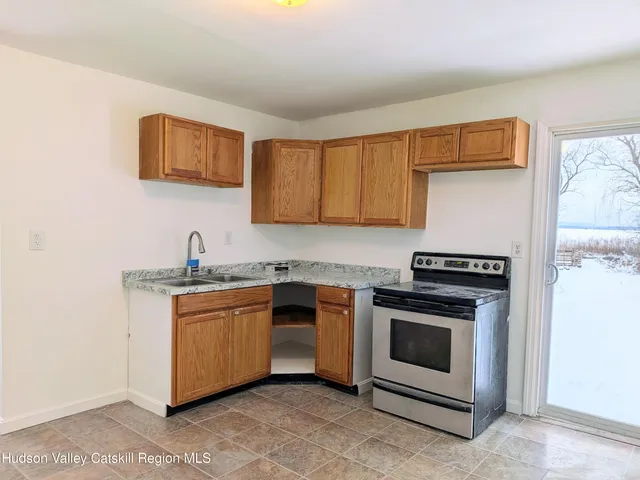 a kitchen with stainless steel appliances granite countertop a stove and a sink