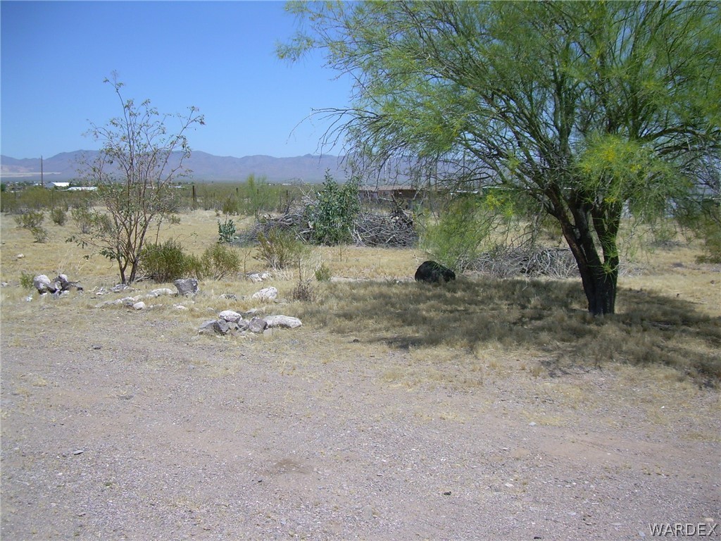 3644 Eloy Road Golden Valley, AZ 86413 - Photo 10 of 35 a view of a lake with a mountain in the background