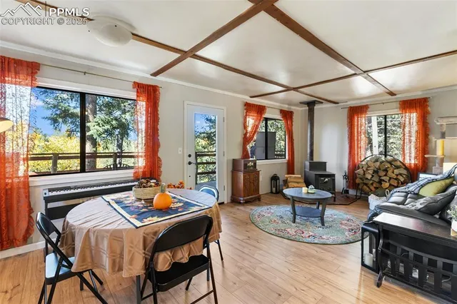 a living room with furniture a rug and a large window