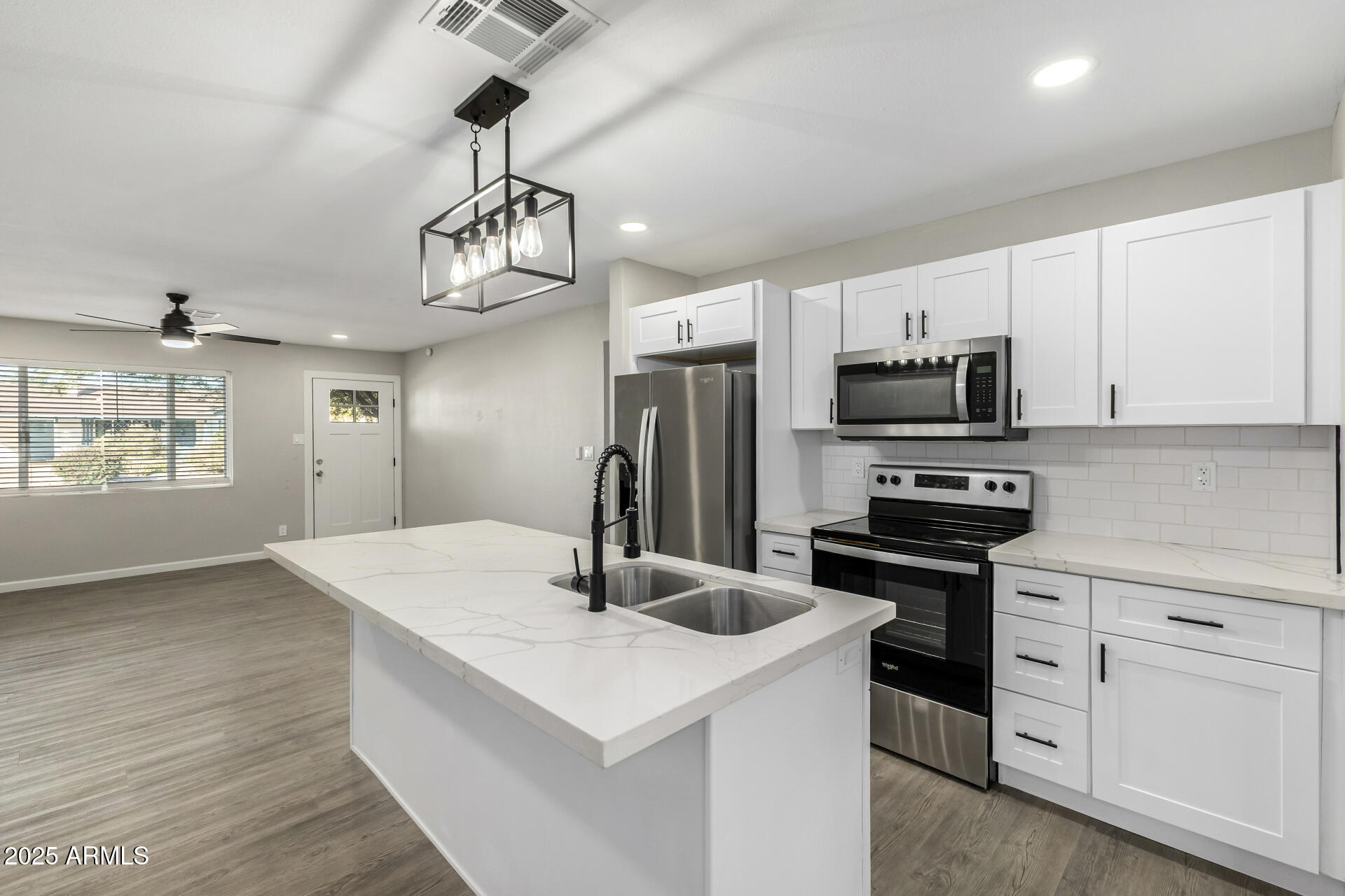 331 East Pierce Street Tempe, AZ 85288 - Photo 12 of 37 a kitchen with stainless steel appliances a sink stove and refrigerator