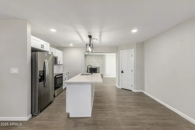 a view of a kitchen and a sink