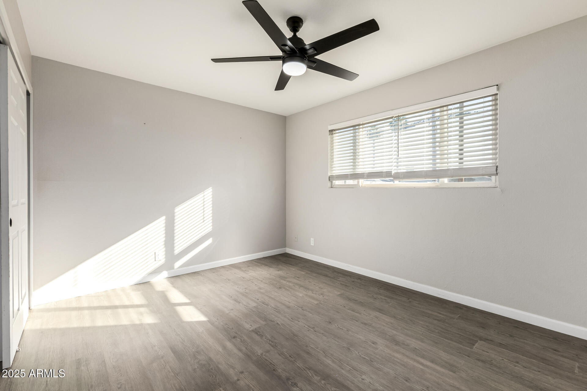 331 East Pierce Street Tempe, AZ 85288 - Photo 15 of 37 a view of empty room with wooden floor and fan