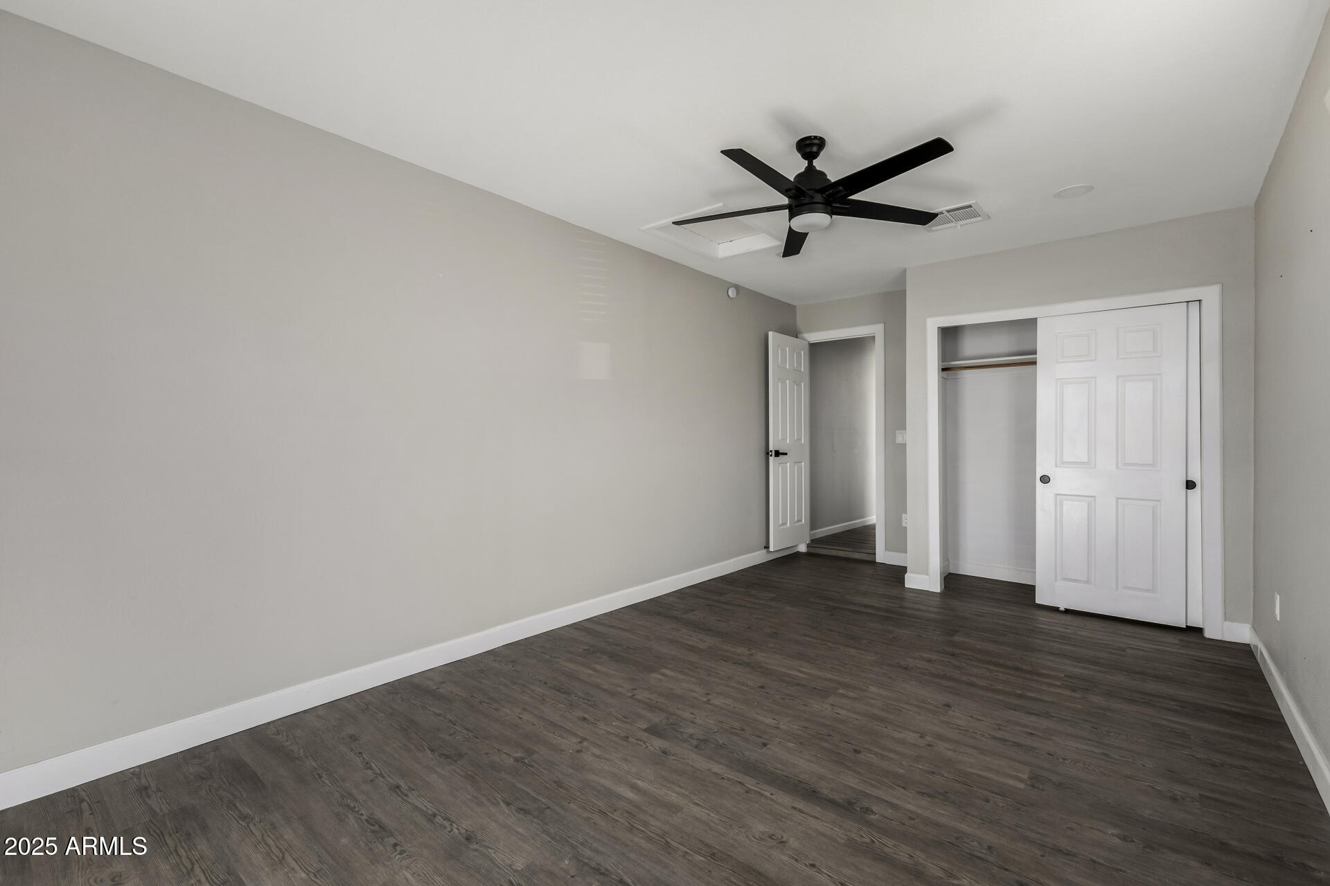 331 East Pierce Street Tempe, AZ 85288 - Photo 20 of 37 a view of an empty room with wooden floor