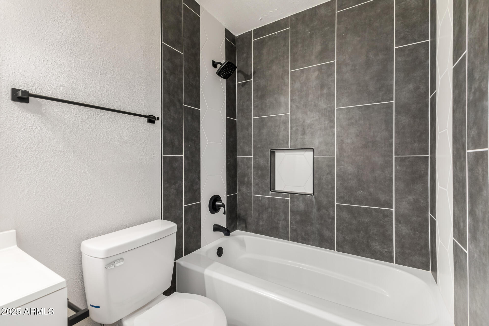 331 East Pierce Street Tempe, AZ 85288 - Photo 22 of 37 a bathroom with a toilet and a bathtub