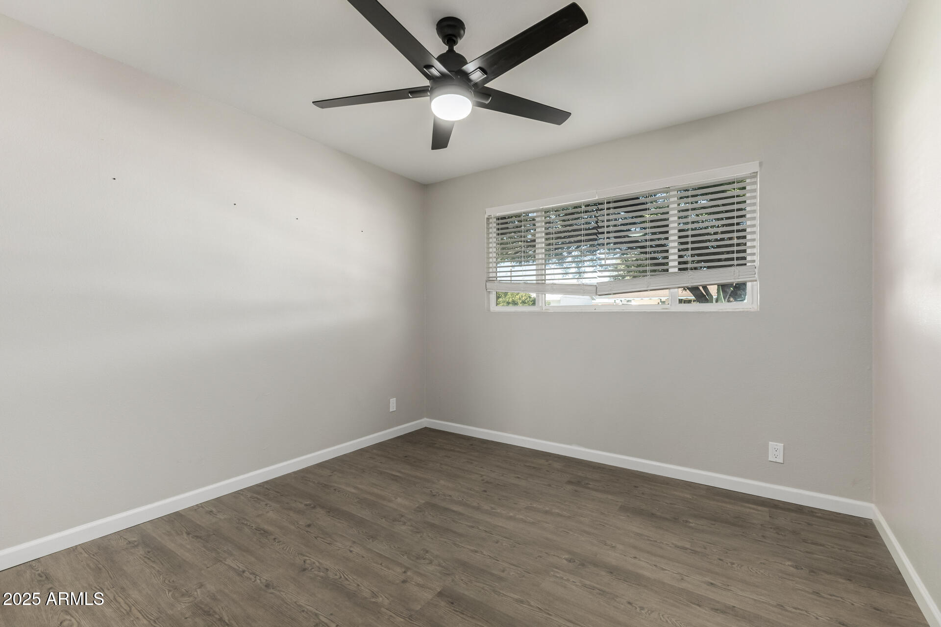 331 East Pierce Street Tempe, AZ 85288 - Photo 23 of 37 an empty room with a window and a ceiling fan
