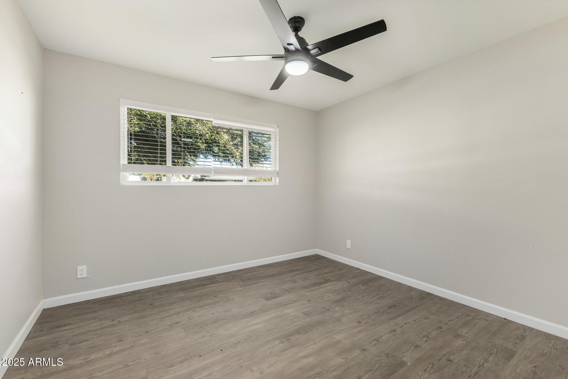 331 East Pierce Street Tempe, AZ 85288 - Photo 25 of 37 an empty room with a window and a fan
