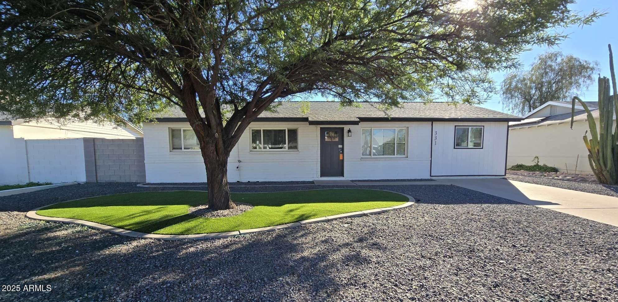 331 East Pierce Street Tempe, AZ 85288 - Photo 32 of 37 a view of a house with swimming pool next to a yard