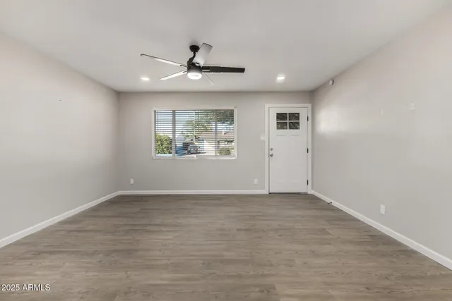 a view of an empty room with a window