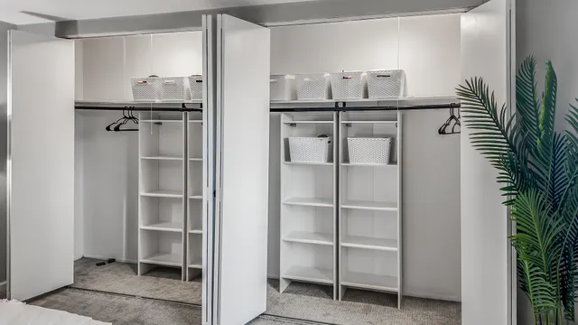 a bathroom with a sink toilet vanity and shower