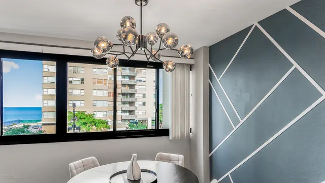 a view of a dining room with furniture window and outside view