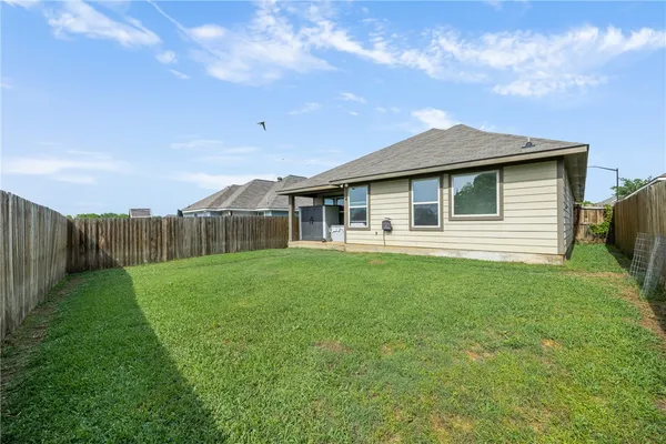 a front view of a house with yard