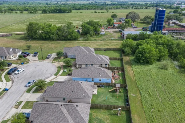 an aerial view of a house with outdoor space swimming pool and mountains