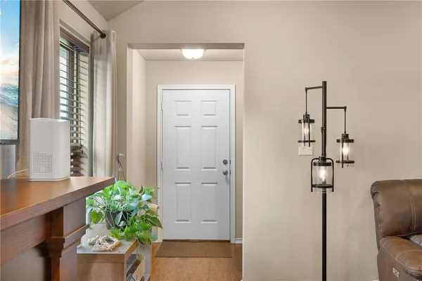 a room that has a lot of potted plant in it