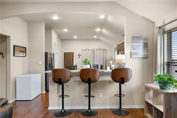 a living room with furniture and potted plant
