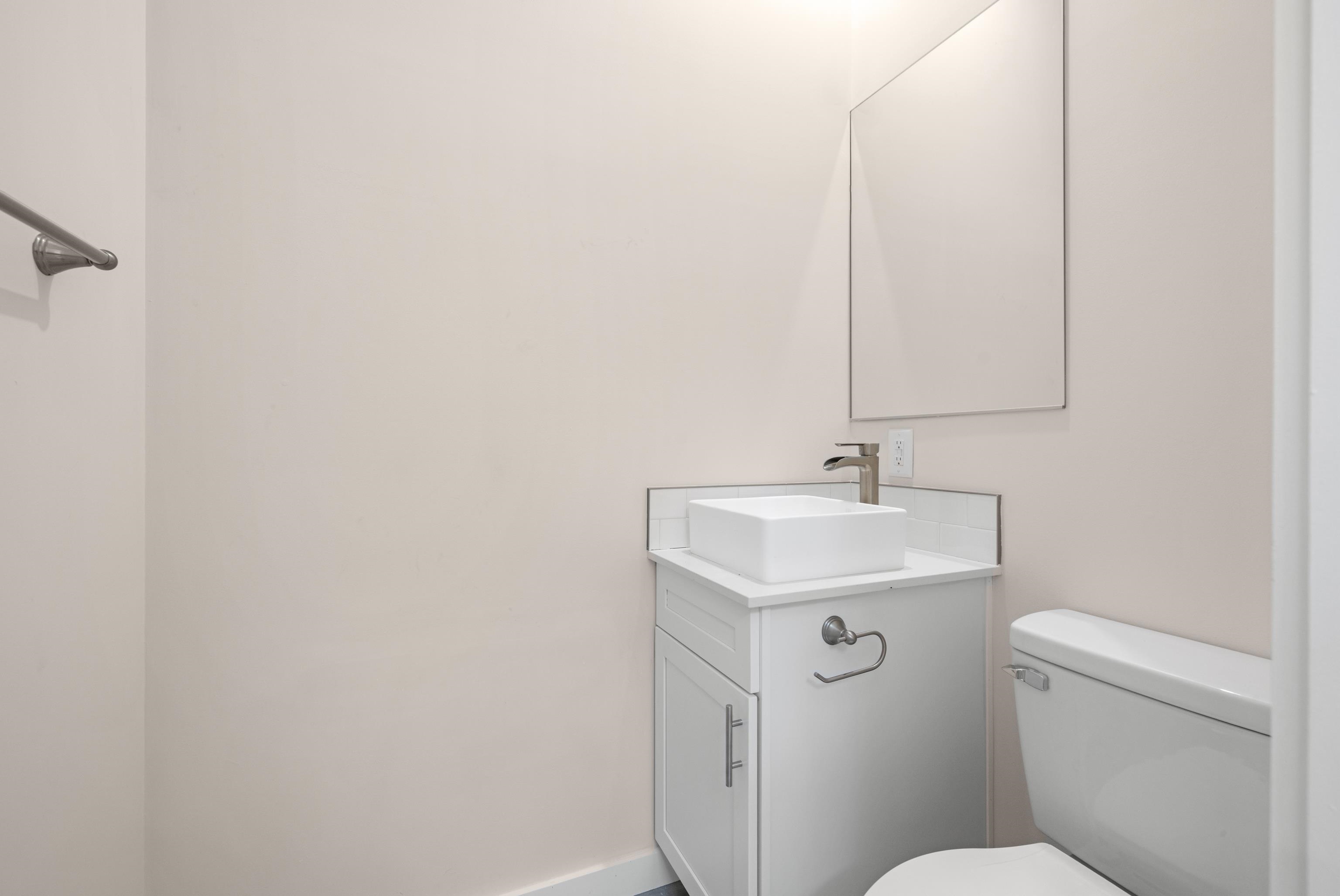 4100 Rte 9 South, Unit 39 Rio Grande, NJ 08242 - Photo 10 of 22 a bathroom with a sink a toilet and a mirror