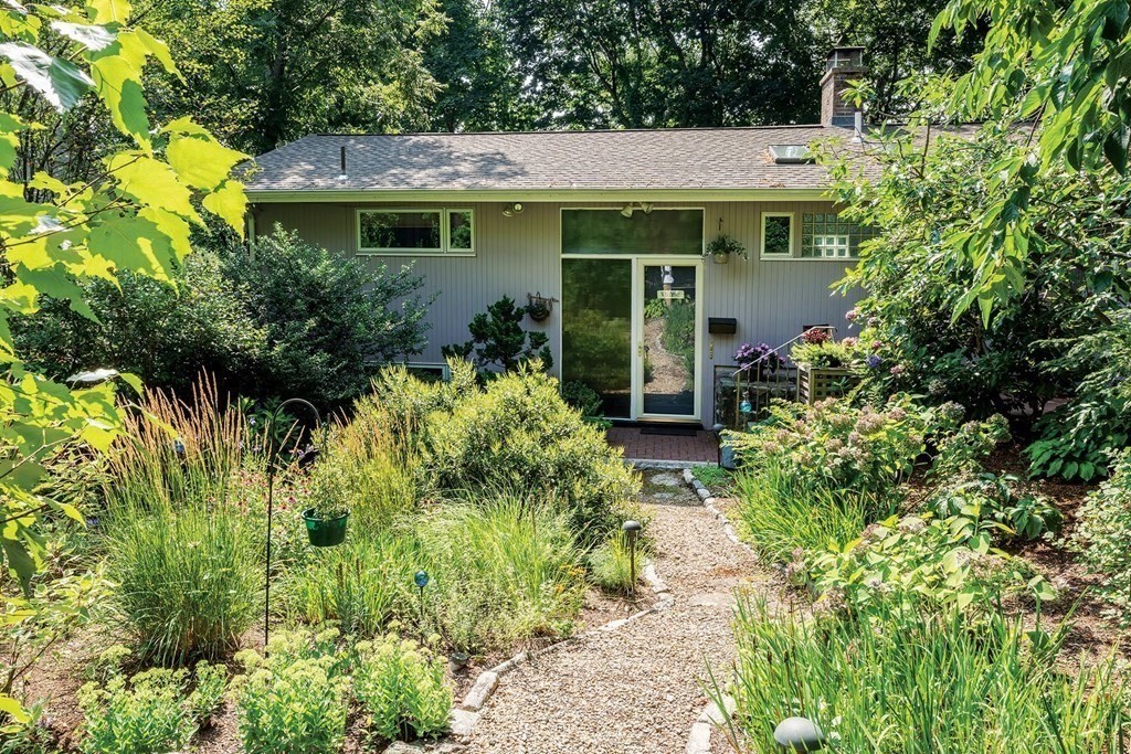 26 Valley Spring Road Newton, MA 02458 - Photo 2 of 24 a view of a house with potted plants and large trees