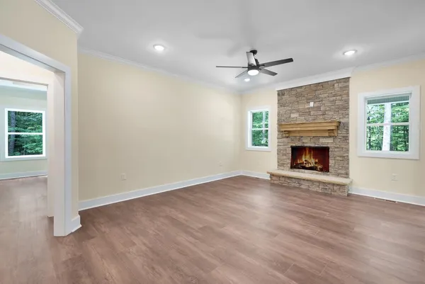 a kitchen with stainless steel appliances white cabinets and a refrigerator