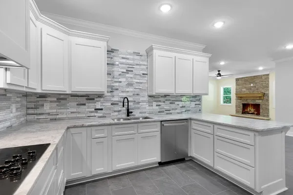 a view of kitchen with refrigerator and window