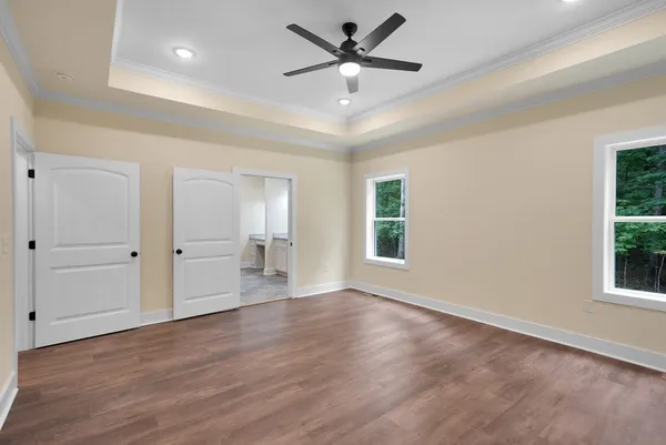 a spacious bathroom with a double vanity sink and mirror