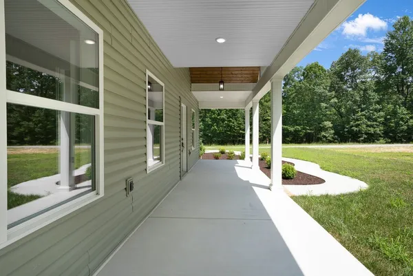 a view of a patio with a backyard